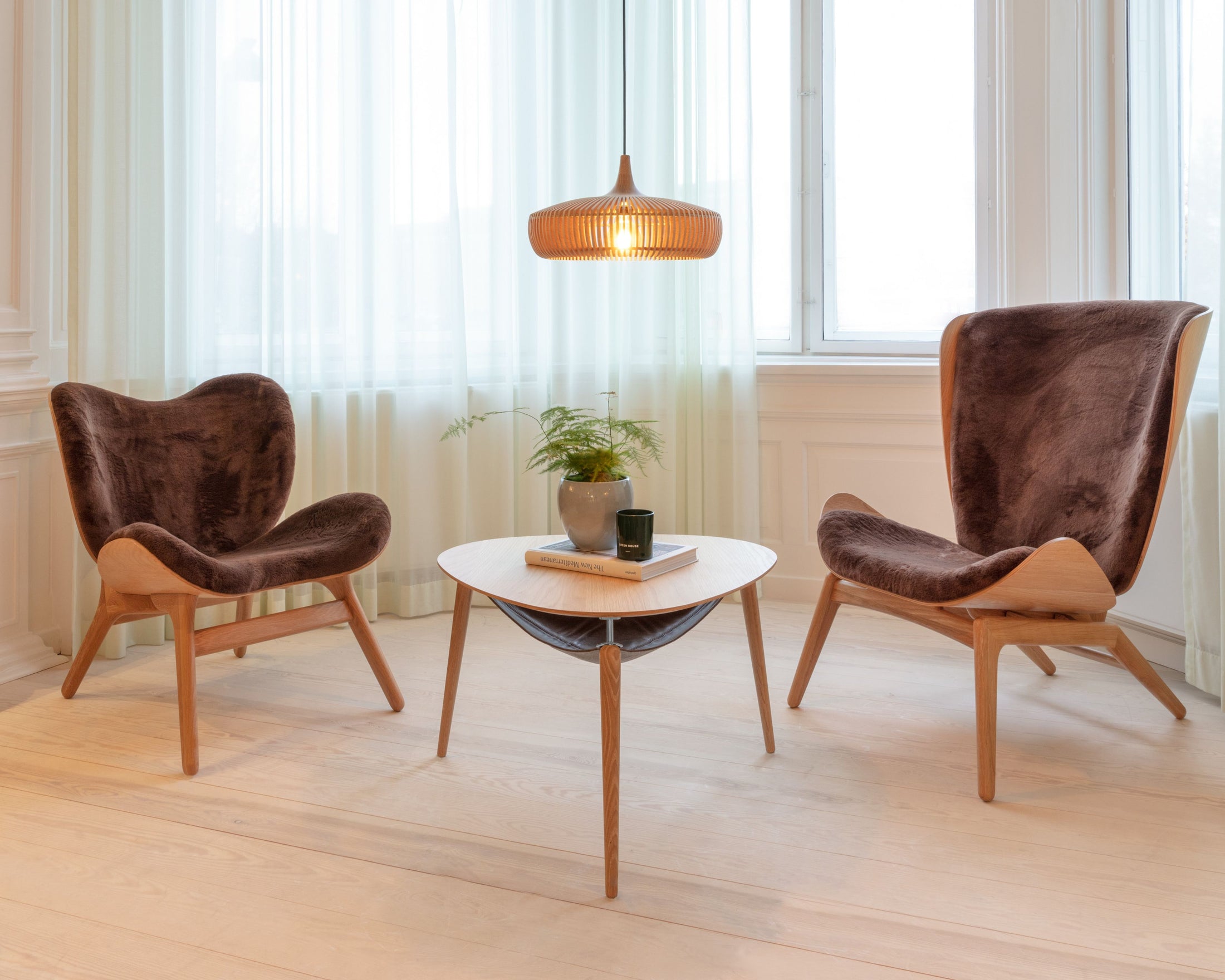 Living room in soft daylight with sofa and table lamp