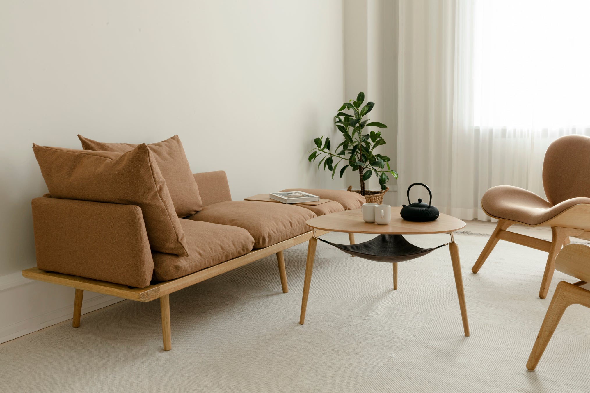 Living room in soft daylight with sofa and table lamp